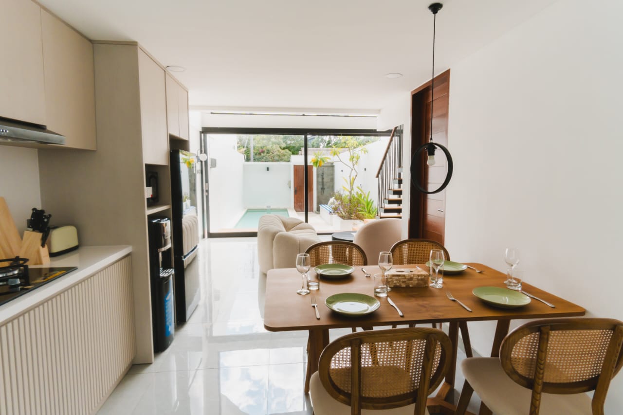 dining space and living room open or enclosed to uour private swimming pool