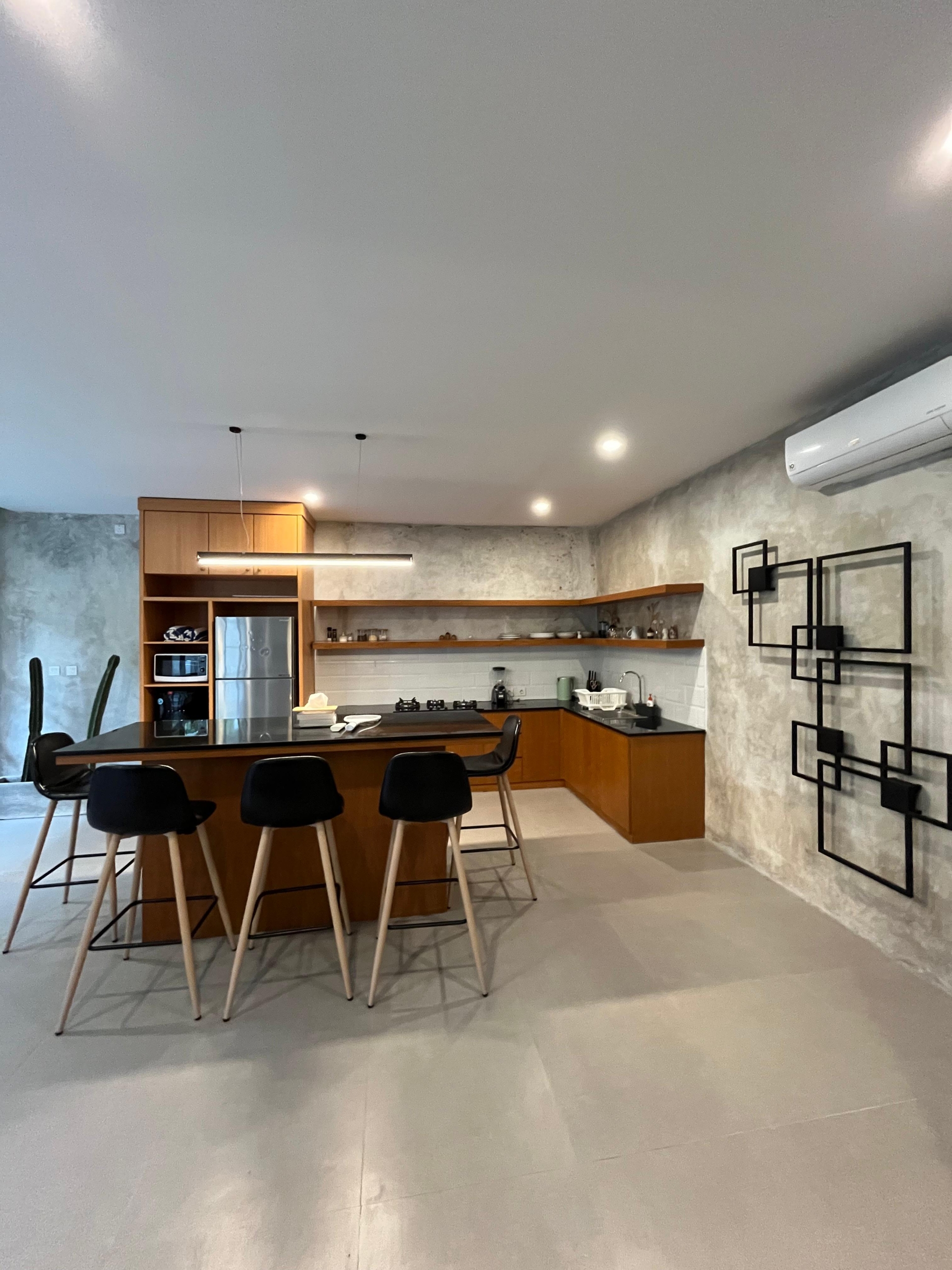 Sleek open kitchen with a chic breakfast bar