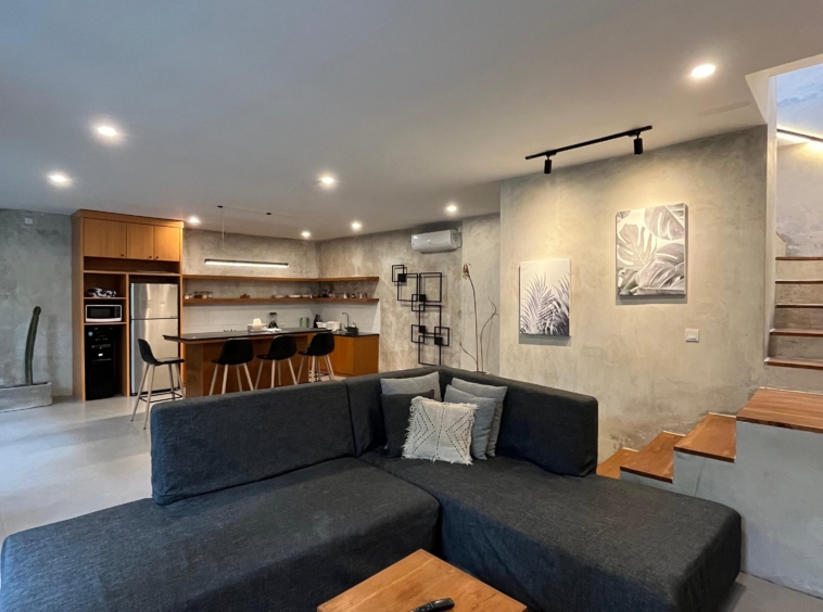 Open kitchen leading to a bright living room