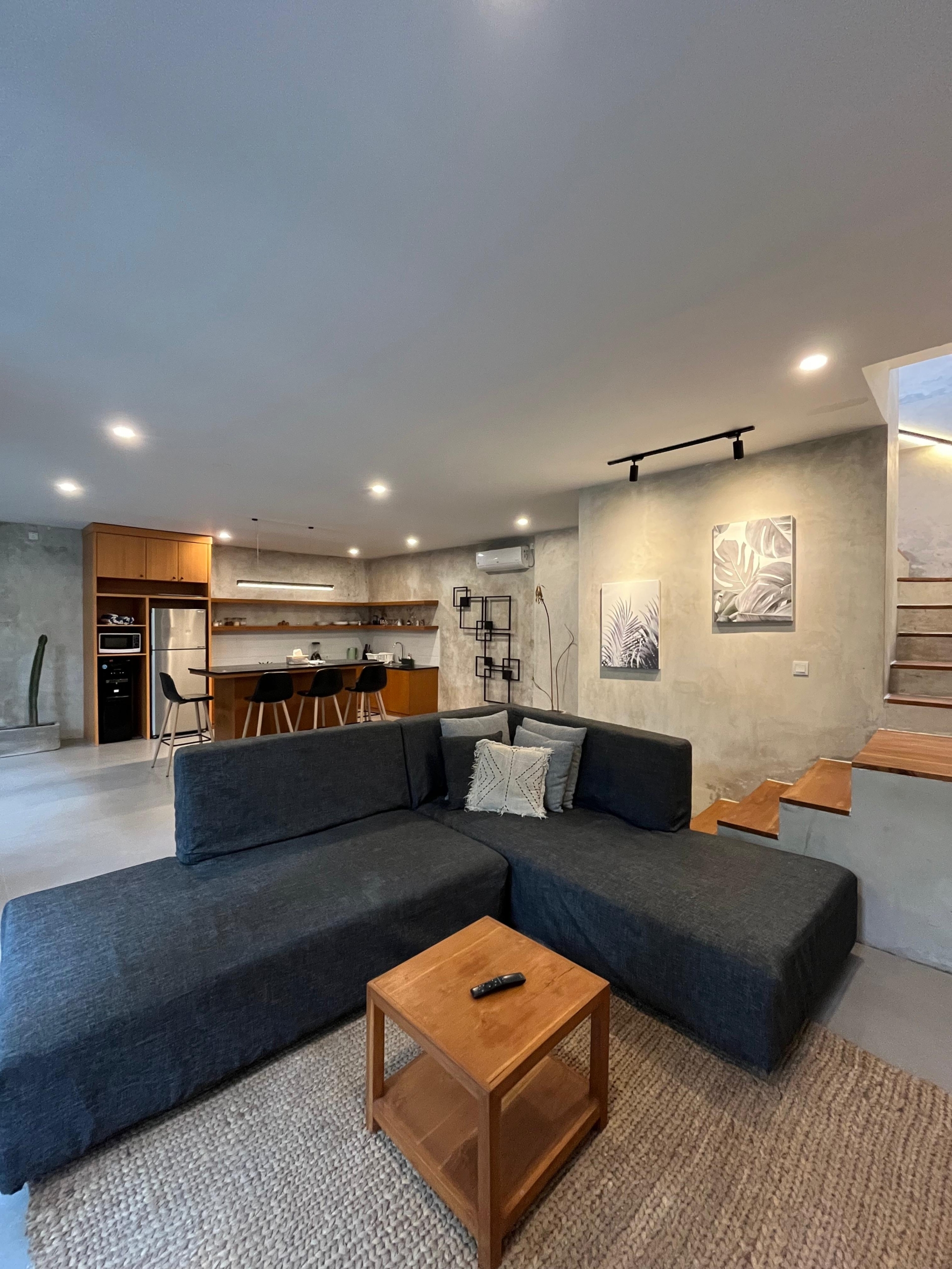 Open kitchen leading to a bright living room