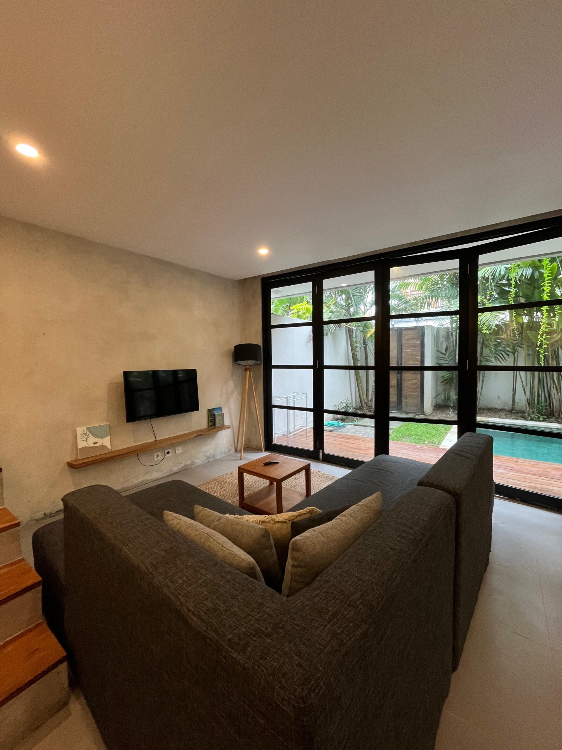 Cozy living area with pool views