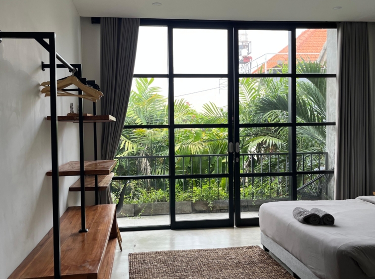 Bedroom overlooks lush greenery