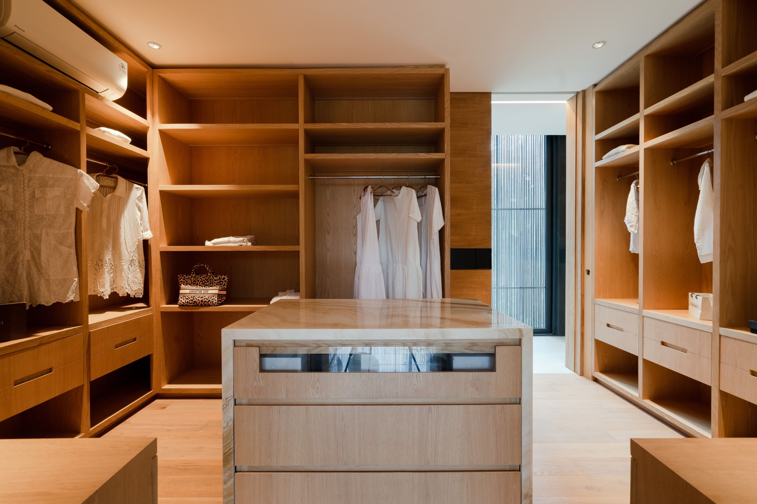 wardrobe with marbe table in the middle