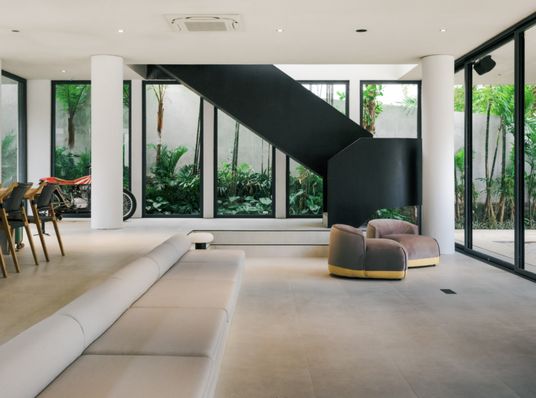 The modern stairs, long sofa, quality of the floor, motorbike in the corner.. Everythings is perfect in this villa
