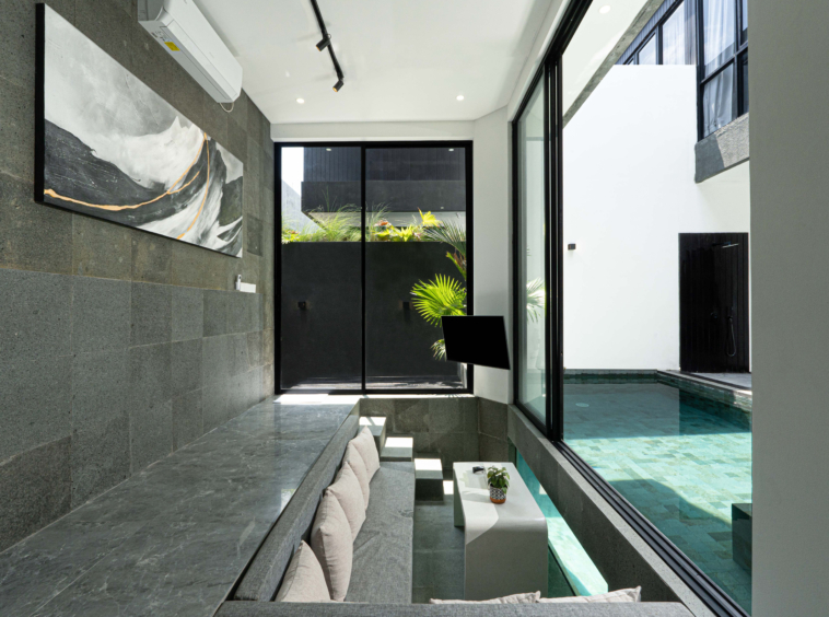 living room with pool view nd under pool view