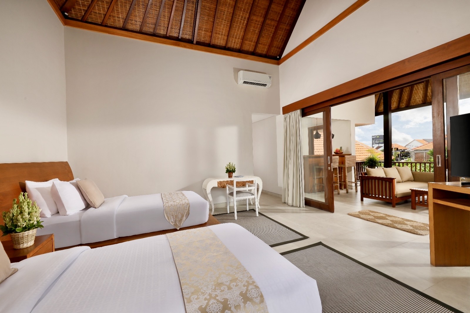 Twin bed in this bedroom. Wood ceiling, luxurious tiles. Guest love this villa