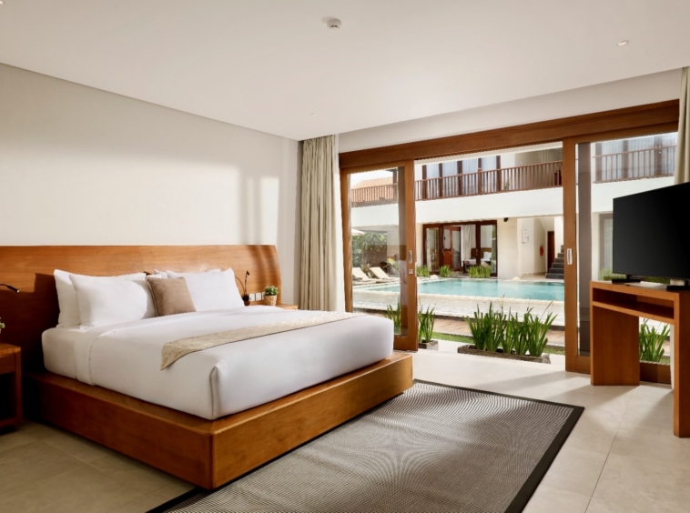 One of the 9 bedrooms with a wooden bed