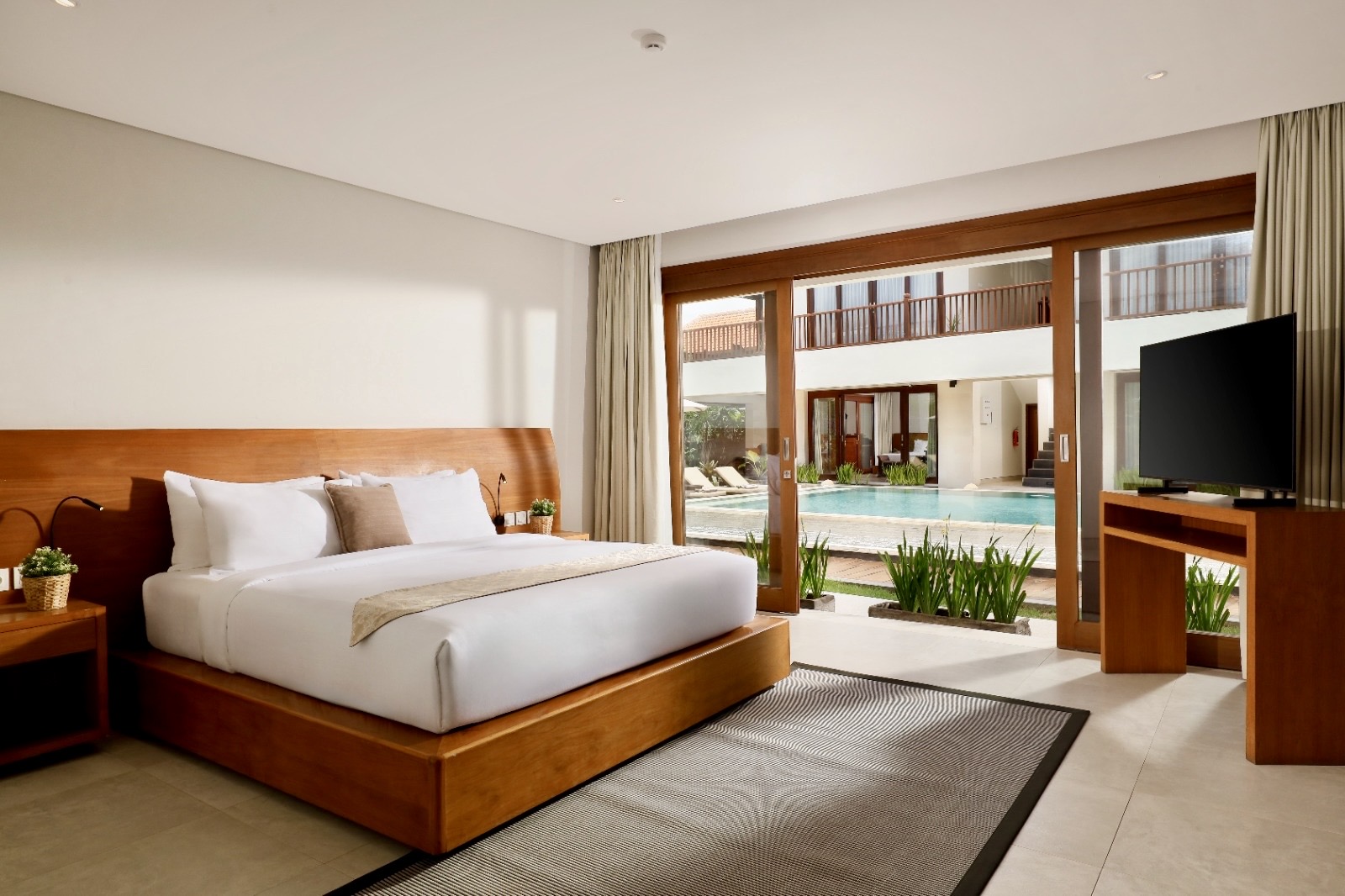 One of the 9 bedrooms with a wooden bed