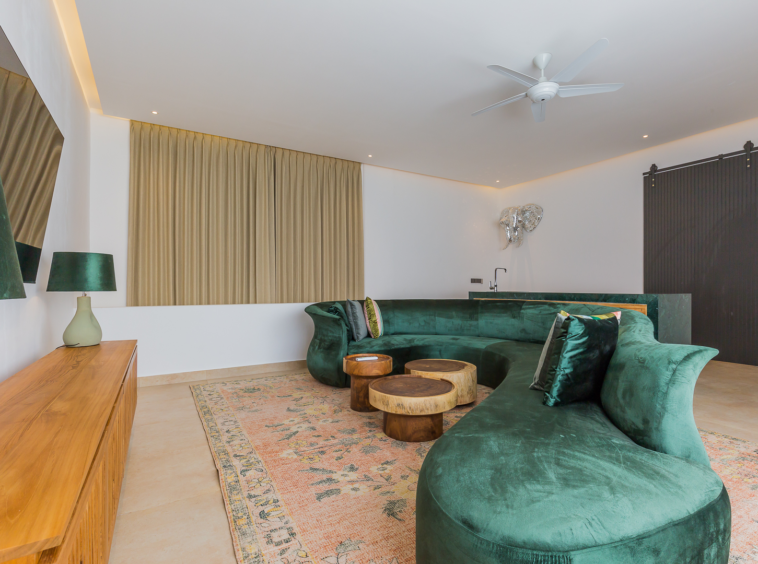 Living room with velvet green sofa in Luxury 3 Bedrooms Villa in Prime Umalas