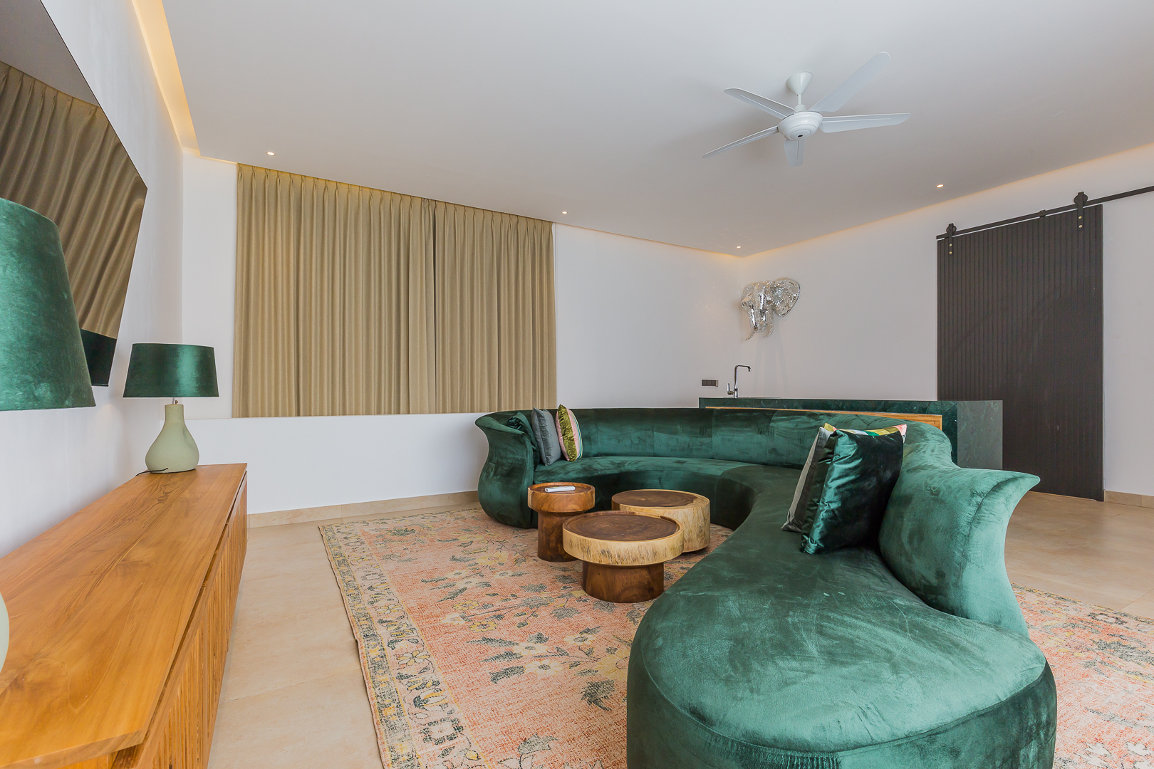 Living room with velvet green sofa in Luxury 3 Bedrooms Villa in Prime Umalas
