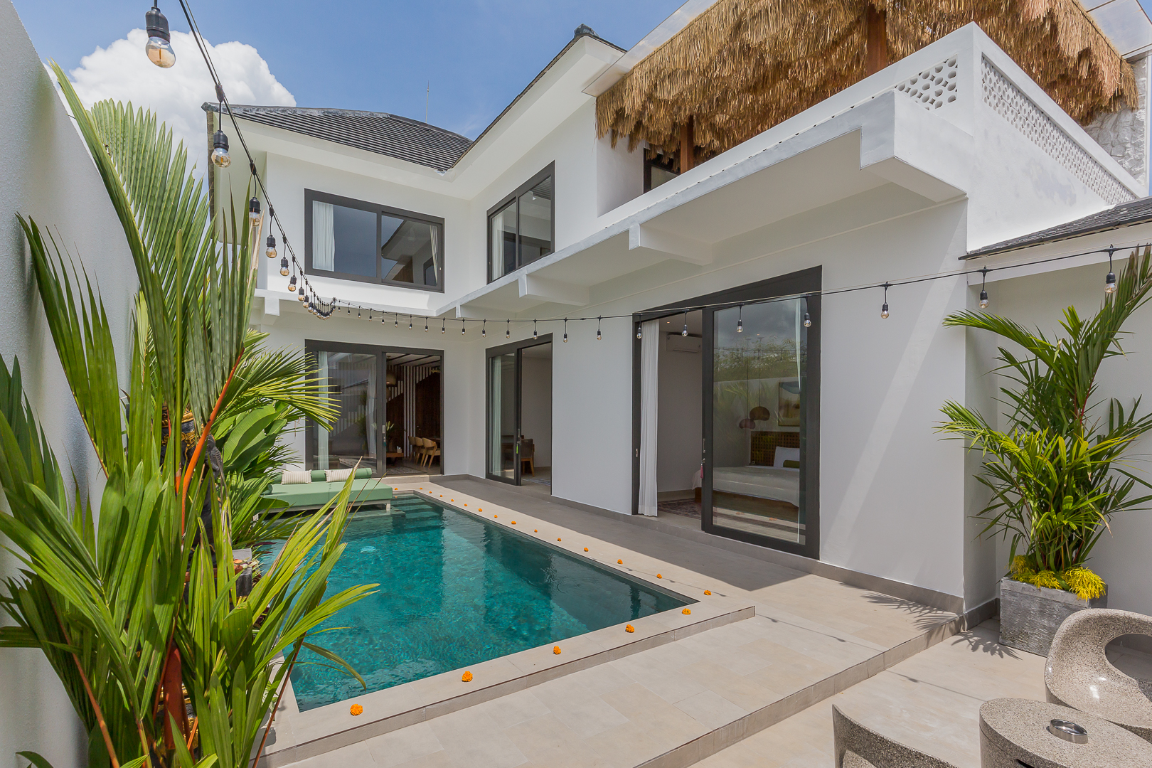 Private swimming pool area with tropical plants in Luxury 3 Bedrooms Villa in Prime Umalas